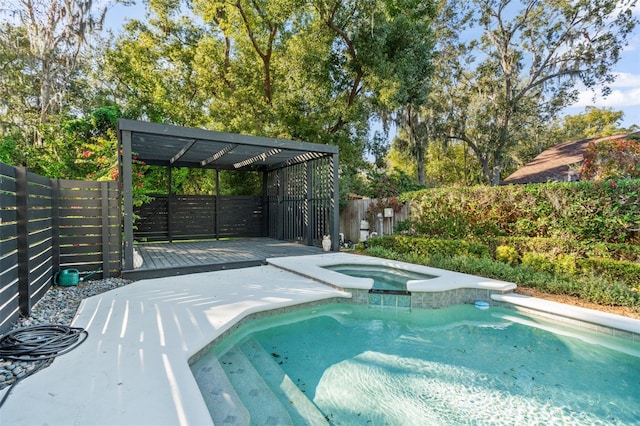 view of swimming pool with an in ground hot tub and a deck