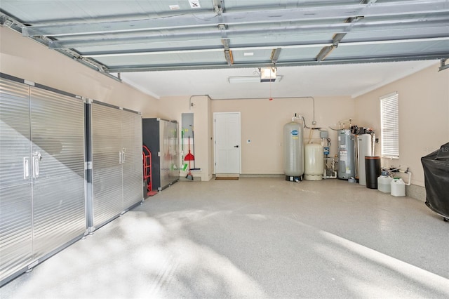 garage featuring electric water heater and a garage door opener