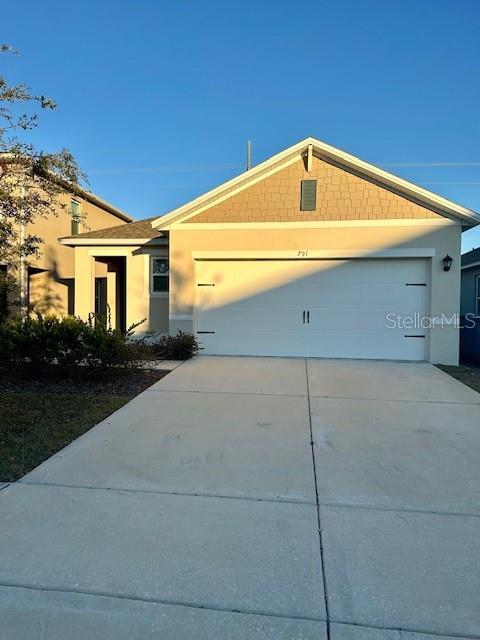 single story home with a garage