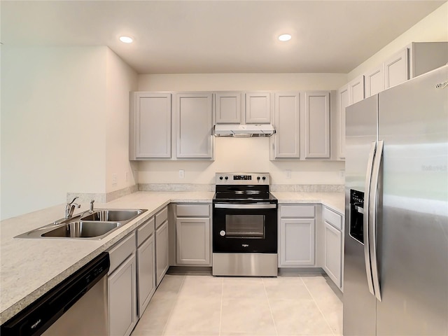 kitchen featuring light tile patterned flooring, sink, and appliances with stainless steel finishes