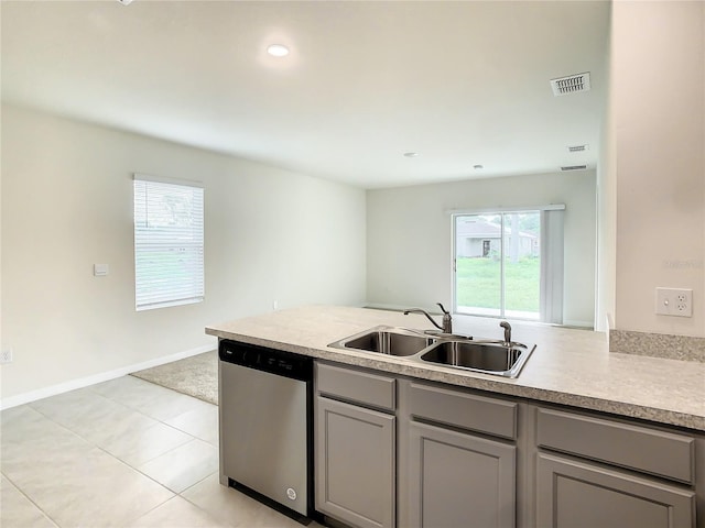 kitchen with dishwasher, gray cabinets, a healthy amount of sunlight, and sink