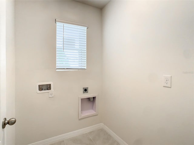 laundry area featuring hookup for an electric dryer, washer hookup, and light tile patterned flooring