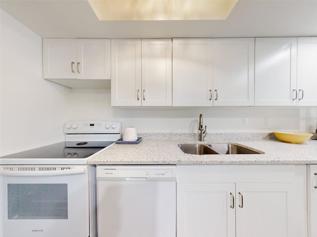 kitchen featuring dishwasher, white range, white cabinetry, and sink