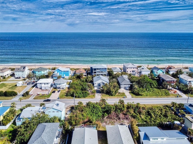 aerial view featuring a water view and a beach view