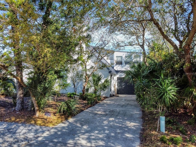 view of property hidden behind natural elements