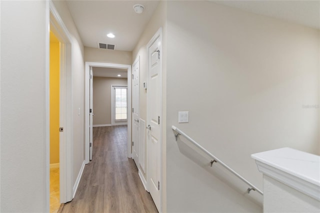 corridor featuring light hardwood / wood-style floors