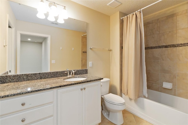 full bathroom featuring tile patterned flooring, shower / bath combination with curtain, a textured ceiling, toilet, and vanity