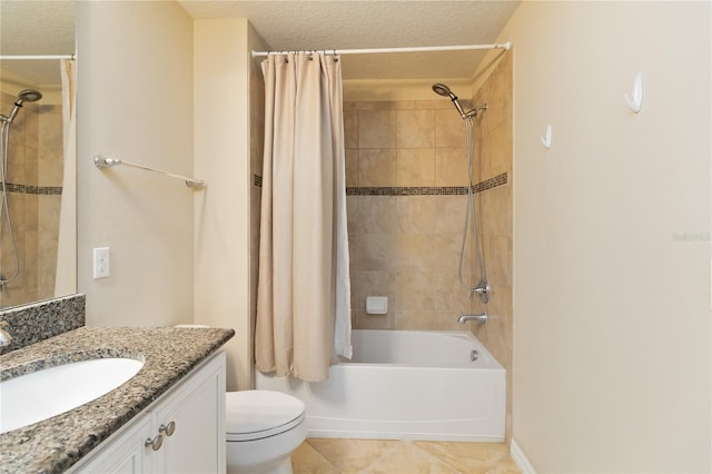 full bathroom with vanity, a textured ceiling, shower / tub combo with curtain, and toilet