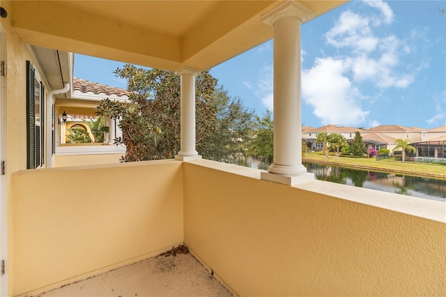 balcony featuring a water view