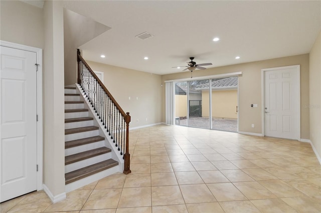 interior space featuring ceiling fan and light tile patterned floors