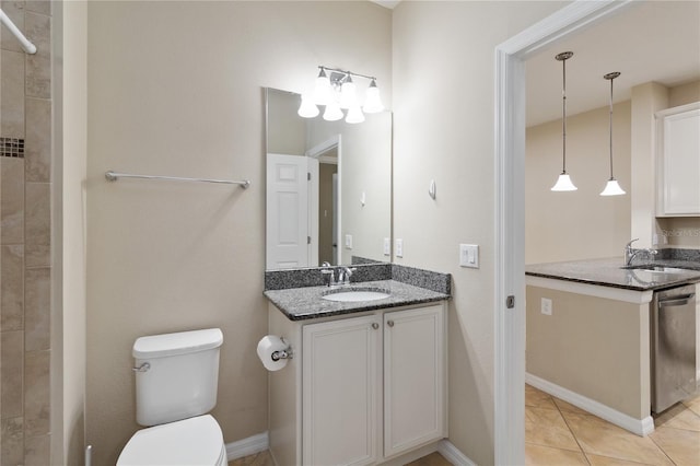 bathroom featuring tile patterned flooring, vanity, and toilet