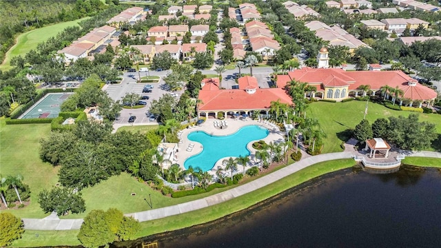 birds eye view of property with a water view