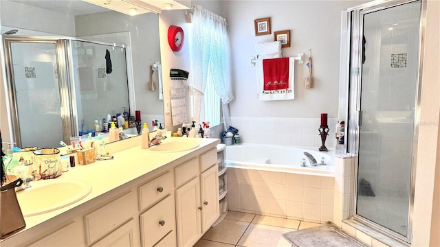 bathroom featuring tile patterned flooring, vanity, and independent shower and bath