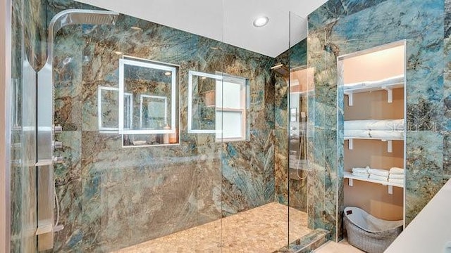 bathroom with tiled shower