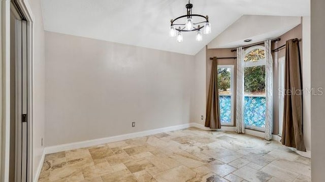 interior space with lofted ceiling and a notable chandelier