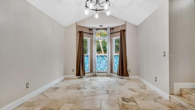 unfurnished room with lofted ceiling and a notable chandelier