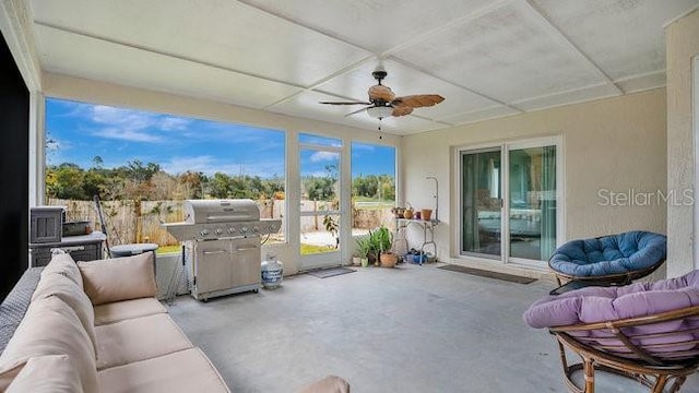 view of patio with ceiling fan, a grill, and an outdoor hangout area