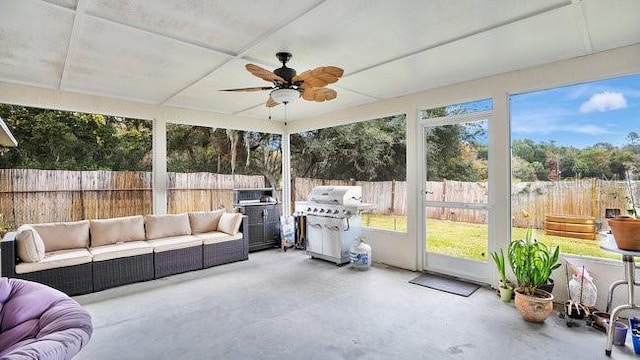 sunroom featuring plenty of natural light and ceiling fan