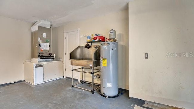 utility room featuring water heater