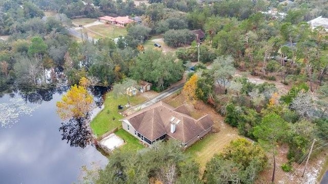 birds eye view of property featuring a water view