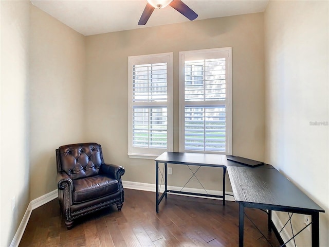 sitting room featuring dark hardwood / wood-style floors and ceiling fan