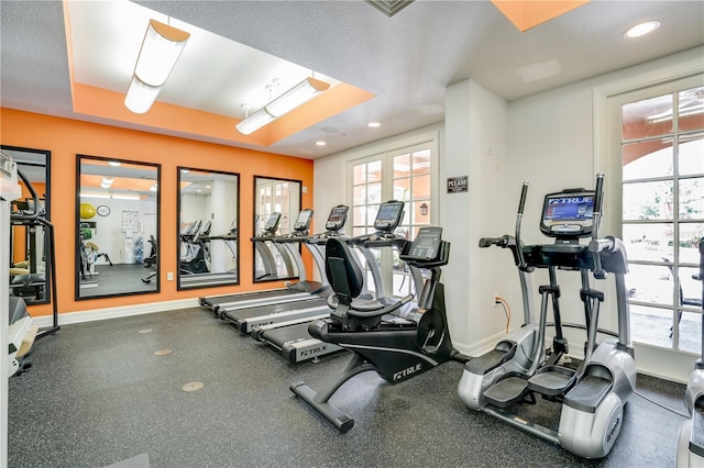 workout area with a textured ceiling and french doors