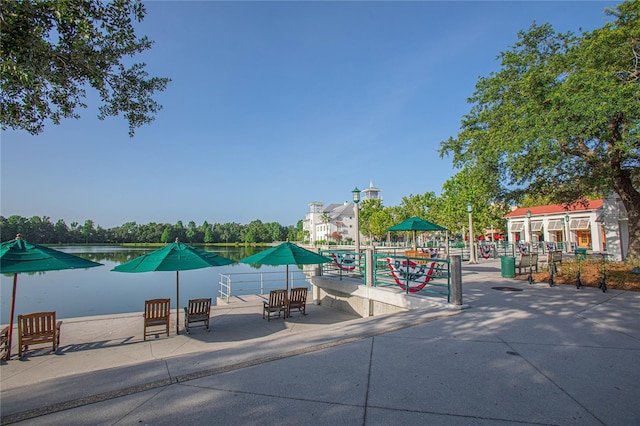 view of swimming pool featuring a water view