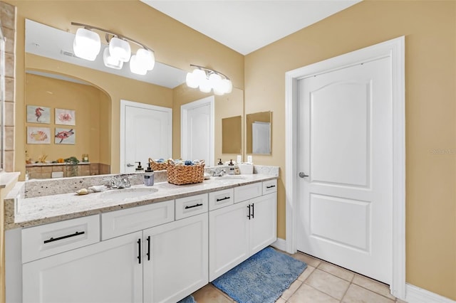 bathroom with tile patterned floors and vanity