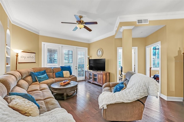 living room with ornamental molding, dark hardwood / wood-style flooring, ceiling fan, and a healthy amount of sunlight