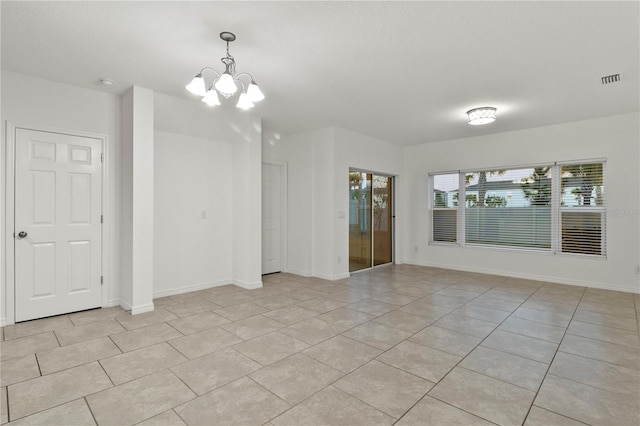 interior space featuring a notable chandelier and light tile patterned flooring