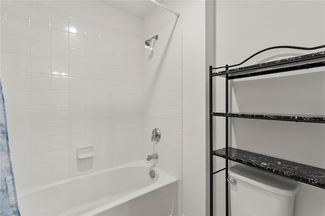 bathroom with shower / bath combo with shower curtain and toilet