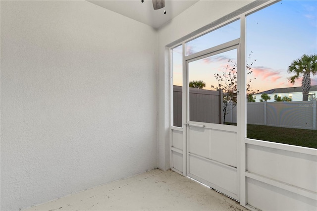 interior space with ceiling fan