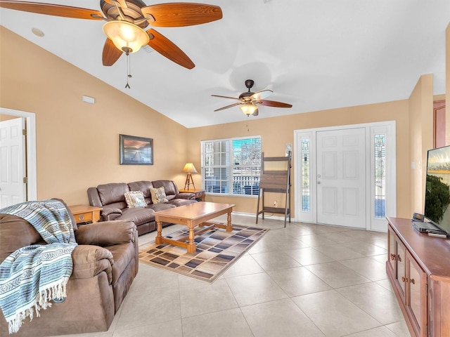 living room featuring light tile patterned floors, vaulted ceiling, and ceiling fan