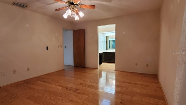 unfurnished room with ceiling fan and light hardwood / wood-style flooring