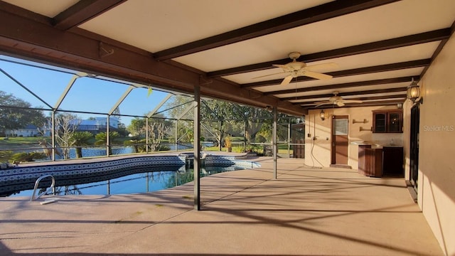 view of swimming pool with a patio, a water view, ceiling fan, and a lanai