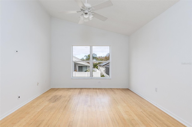 unfurnished room with ceiling fan, lofted ceiling, and light hardwood / wood-style floors