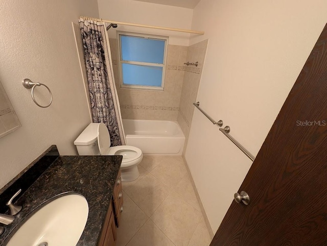 full bathroom featuring tile patterned floors, vanity, toilet, and shower / tub combo with curtain