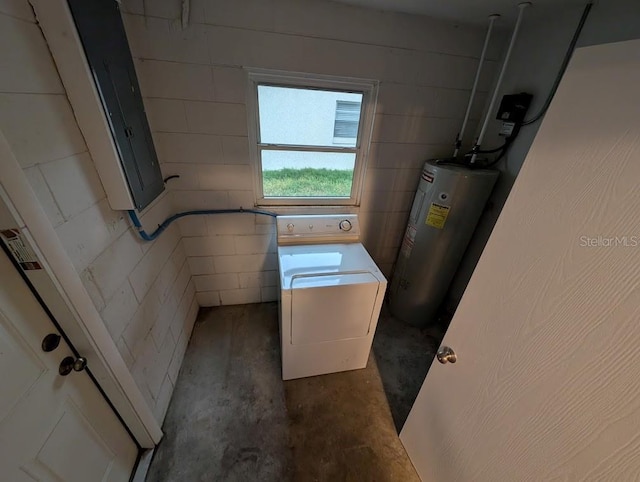 washroom with electric water heater and washer / dryer