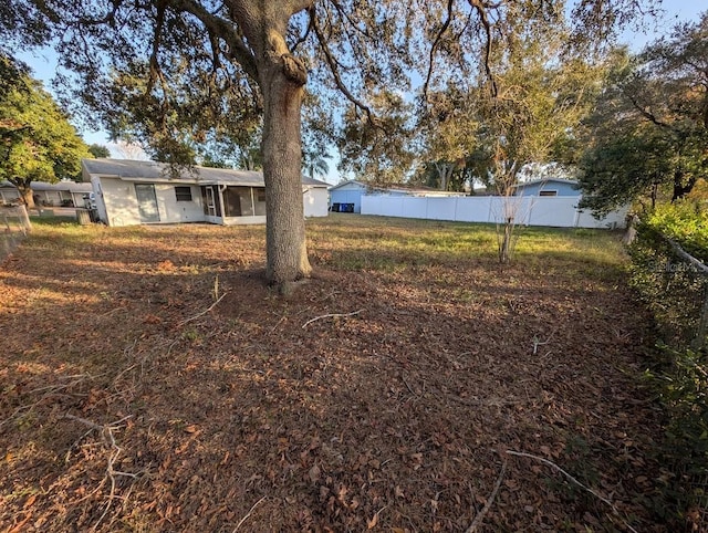 view of yard featuring a sunroom