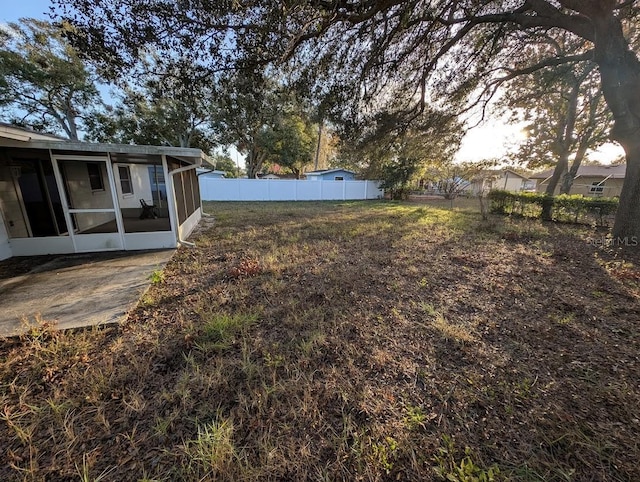 view of yard with a patio area and a sunroom