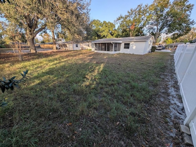 view of yard featuring a sunroom