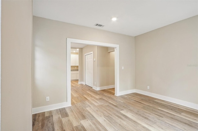 spare room with light wood-type flooring