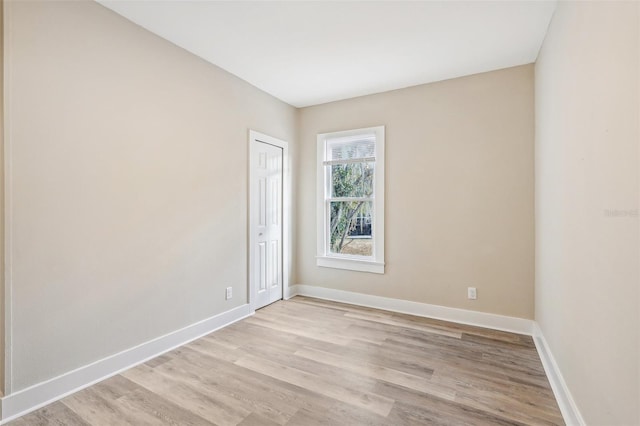 spare room featuring light wood-type flooring