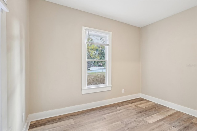 spare room with light hardwood / wood-style flooring