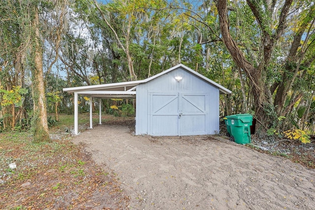 view of outdoor structure with a carport