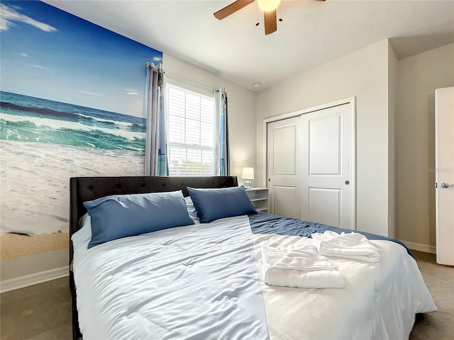 bedroom with ceiling fan and a closet