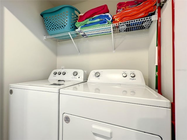 laundry room featuring washing machine and clothes dryer