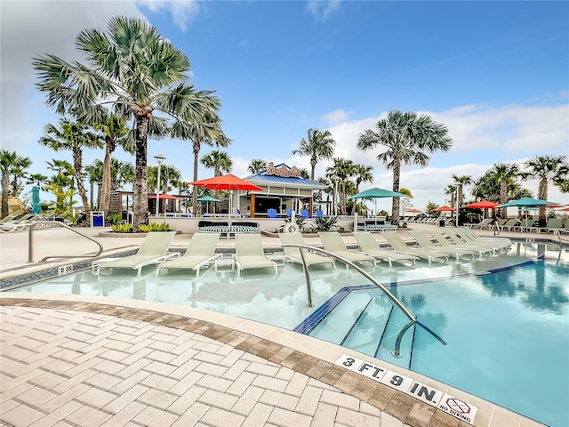 view of swimming pool with a patio area