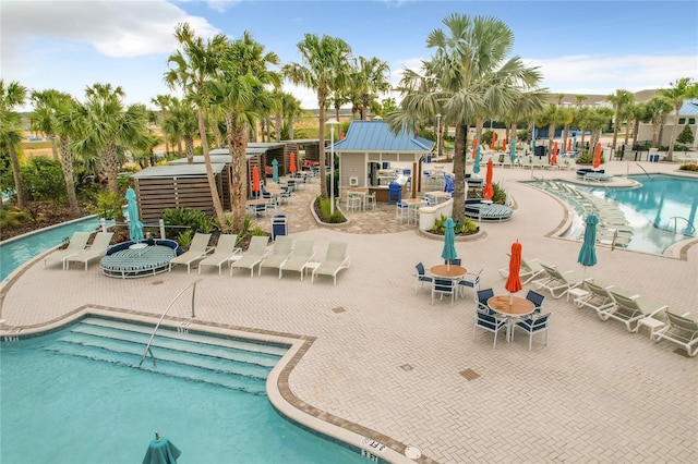 view of swimming pool with a patio area