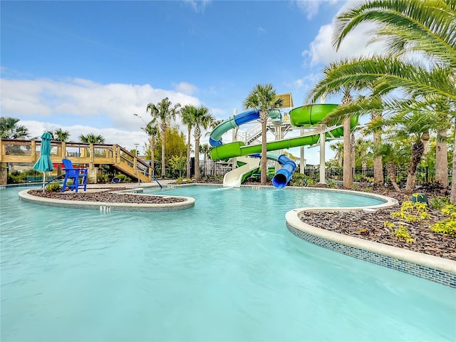 view of swimming pool featuring a water slide